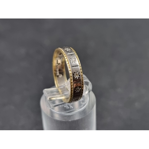 927 - An 18ct white and yellow gold eternity ring, set diamond chips, size N, gross weight 3.8g.... 