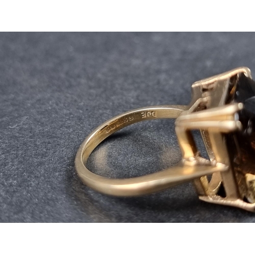 928 - A 9ct gold cocktail ring, set large faceted smoky quartz, size M 1/2, gross weight 6.3g.... 