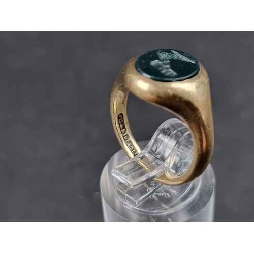 929 - A 9ct gold signet ring, set crested intaglio bloodstone, Birmingham 1991, size M, gross weight 5.8g.... 