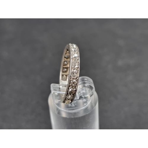 936 - A white metal diamond eternity ring, size P.