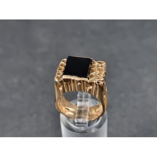 939 - A 9ct gold ring, set black onyx, London 1970, gross weight 12.7g.