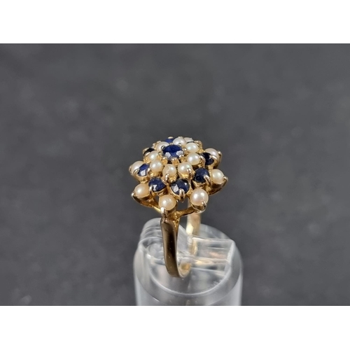 940 - A 9ct gold sapphire and pearl floral cluster ring, London 1968, size L 1/2, gross weight 4.2g.... 