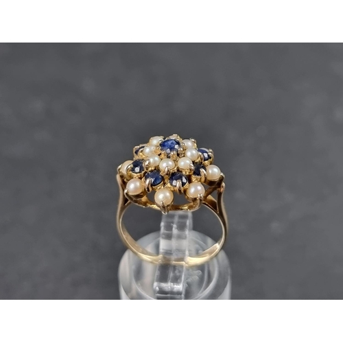 940 - A 9ct gold sapphire and pearl floral cluster ring, London 1968, size L 1/2, gross weight 4.2g.... 