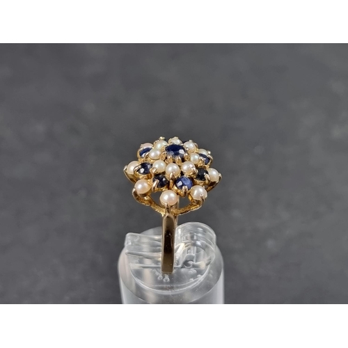 940 - A 9ct gold sapphire and pearl floral cluster ring, London 1968, size L 1/2, gross weight 4.2g.... 