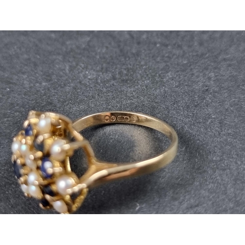 940 - A 9ct gold sapphire and pearl floral cluster ring, London 1968, size L 1/2, gross weight 4.2g.... 