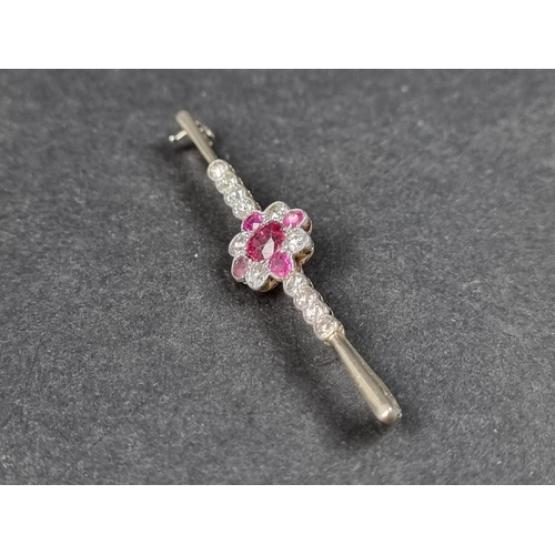 946 - A 1920s ruby and diamond set bar brooch, stamped 18ct/Plat, with a floral cluster of four rubies and... 