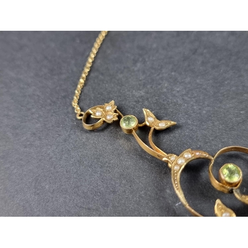 948 - An Edwardian yellow metal peridot and seed pearl necklace, stamped 9ct, 39cm long.