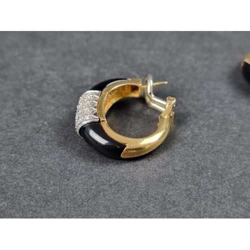 950 - A pair of Bulgari style diamond and black onyx set earrings, stamped 750, 26mm.