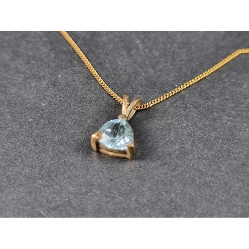 962 - A 9ct gold necklace, with blue zircon pendant, 45cm long; together with a similar pair of ear studs.... 