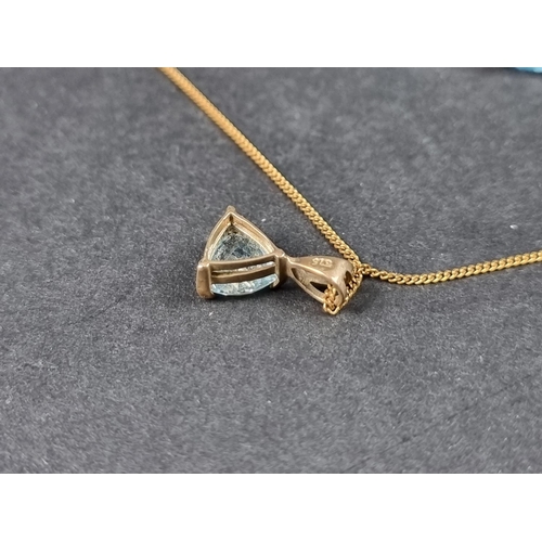 962 - A 9ct gold necklace, with blue zircon pendant, 45cm long; together with a similar pair of ear studs.... 