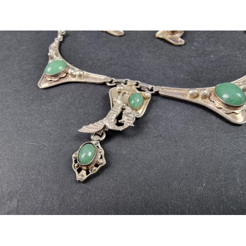 963 - A white metal pendant necklace, set cabochon green stones, 50cm long; together with a matching pair ... 