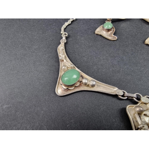 963 - A white metal pendant necklace, set cabochon green stones, 50cm long; together with a matching pair ... 