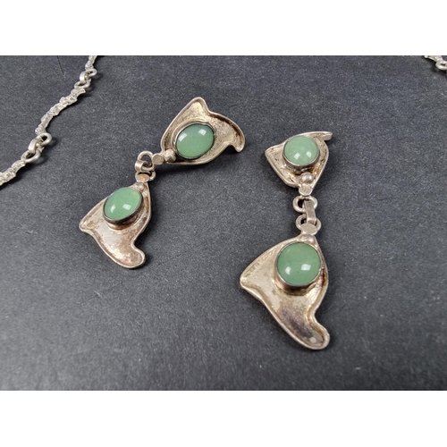 963 - A white metal pendant necklace, set cabochon green stones, 50cm long; together with a matching pair ... 