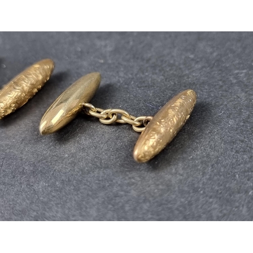 967 - A pair of yellow metal torpedo shaped cufflinks, stamped 18, 24mm.