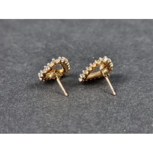 968 - A pair of 9ct gold diamond set 'heart' ear studs, Birmingham 1994, 13mm high, gross weight 2.2g.... 