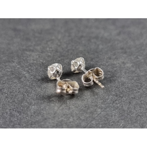 969 - A pair of 18ct gold diamond ear studs, hallmarked, each estimated approx. 0.5ct.