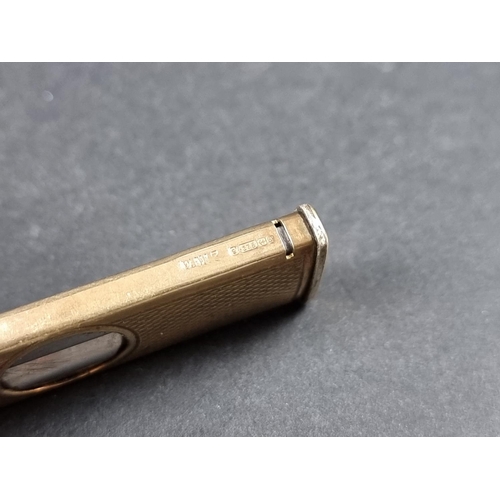 972 - A 9ct gold and steel cigar cutter, having engine turned decoration, by W.M Ltd, Birmingham 1967, 53m... 