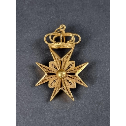 982 - A filigree yellow metal Maltese cross pendant, stamped 'C18', 42mm high.