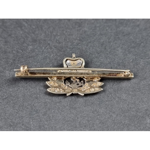 983 - A 9ct gold Royal Naval sweetheart brooch, decorated with red enamel and set small diamonds, 50mm wid... 