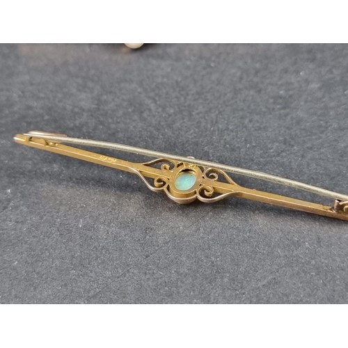 992 - A yellow metal bar brooch, set central oval cabochon opal, stamped 9ct, 6.6cm long; together with an... 