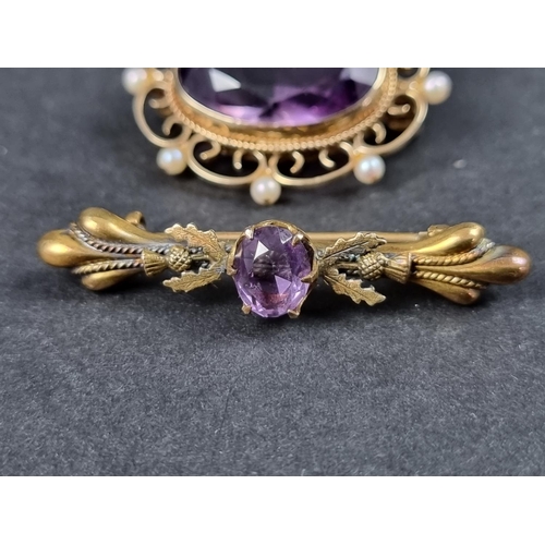 993 - A 9ct gold brooch, set faceted amethyst with eight small pearls, in an openwork setting, 35mm wide; ... 