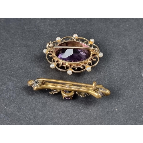 993 - A 9ct gold brooch, set faceted amethyst with eight small pearls, in an openwork setting, 35mm wide; ... 