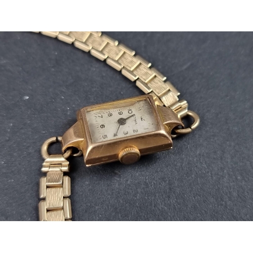 1163 - A vintage Cyma yellow metal manual wind ladies wristwatch, stamped '18k', 18mm x 14mm, on a rolled g... 