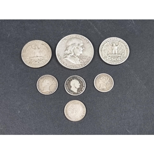 868 - Coins: seven various UK and US silver coins.