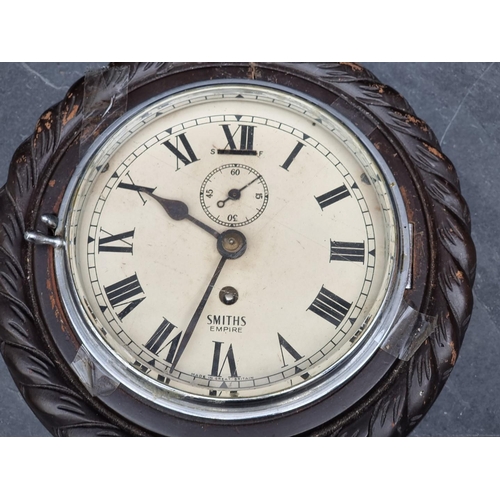 1185 - A Smiths ropetwist frame wall clock, 23.5cm diameter.