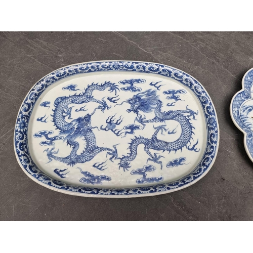 1577 - A Chinese blue and white dish, four character mark to base, painted with dragons, 34.5cm wide; ... 