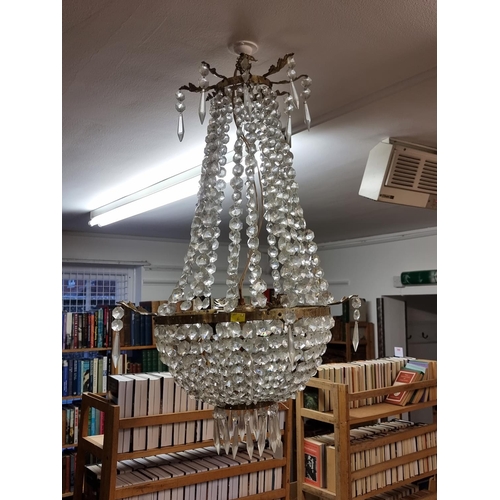 1672 - A large brass and faceted glass chandelier, 80cm high.