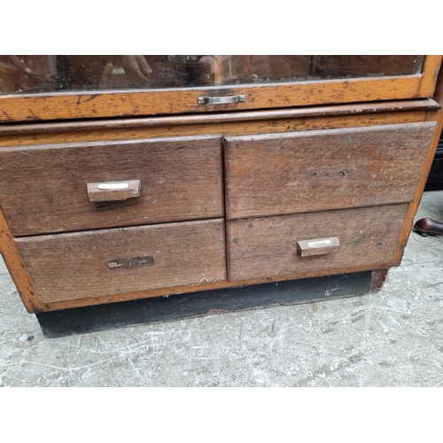 1002 - A vintage oak haberdashery cabinet, 168.5cm high x 87cm wide x 55cm deep.