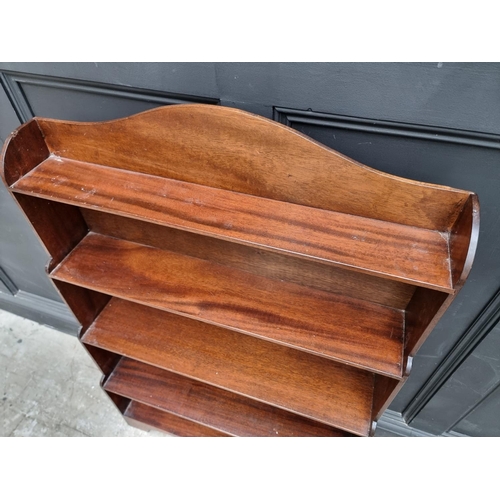 1006 - A reproduction mahogany open waterfall bookcase, 78cm wide. 