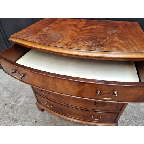 1008 - A reproduction mahogany bowfront chest of drawers, 79cm wide. 