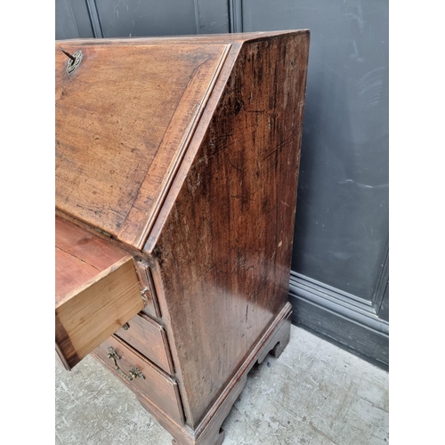 1014 - A small George III mahogany bureau, 76cm wide. 