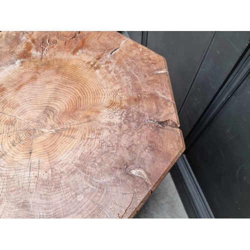 1021 - A large octagonal tree trunk pedestal, probably cedar, 76.5cm high x 55cm wide.