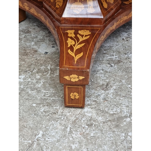 1022 - A Dutch walnut and marquetry circular pedestal table, 79.5cm diameter. 