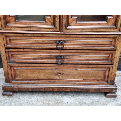 1031 - A late 19th century Continental walnut bookcase, 90cm wide.