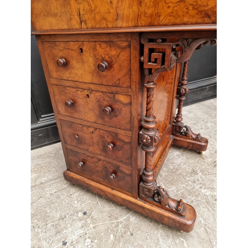 1037 - A Victorian figured walnut piano top Davenport, 58cm wide.