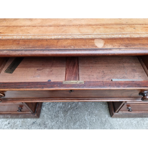 1040 - A late Victorian mahogany pedestal desk, 137cm wide.