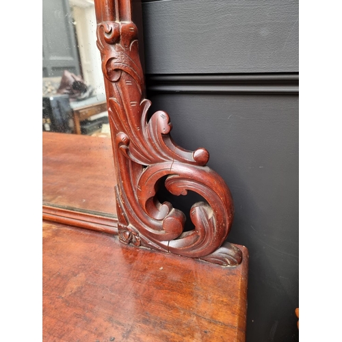 1054 - A large Victorian mahogany inverted breakfront mirror back sideboard, 196cm wide.