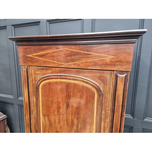 1058 - A late Victorian mahogany crossbanded and line inlaid single wardrobe, 91cm wide.