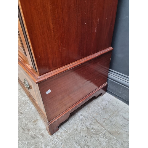 1058 - A late Victorian mahogany crossbanded and line inlaid single wardrobe, 91cm wide.