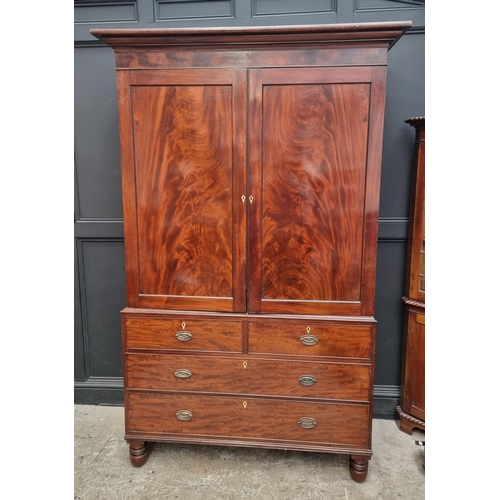 1061 - A large George IV mahogany linen press, possibly Scottish, with five sliding trays and bone escutche... 