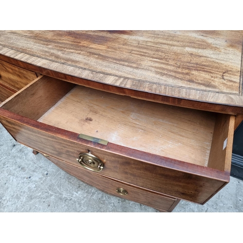 1070 - A George III mahogany bowfront chest of drawers, 117.5cm wide.