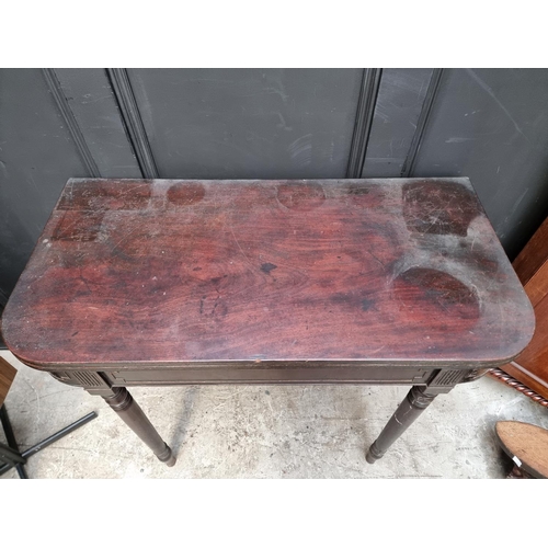 1072 - A late George III mahogany tea table, with double gateleg action, 91cm wide.  ... 