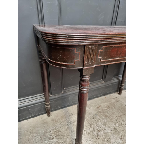 1072 - A late George III mahogany tea table, with double gateleg action, 91cm wide.  ... 