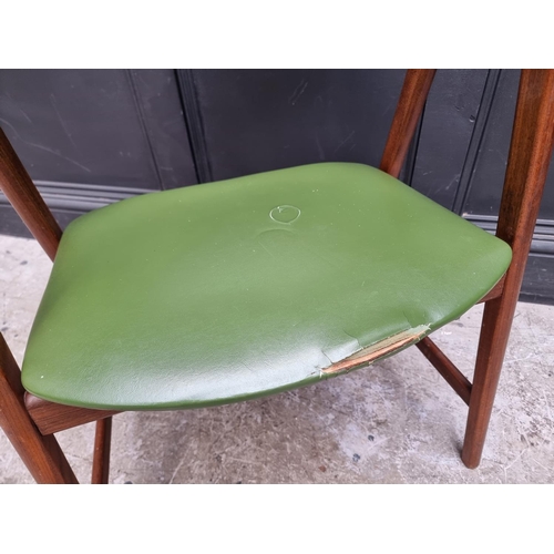 1073 - A vintage teak and green vinyl elbow chair, in the manner of Guilleumas. 