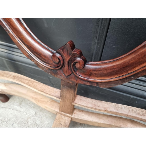 1076 - A Victorian style carved walnut childs' settee, 91cm wide.