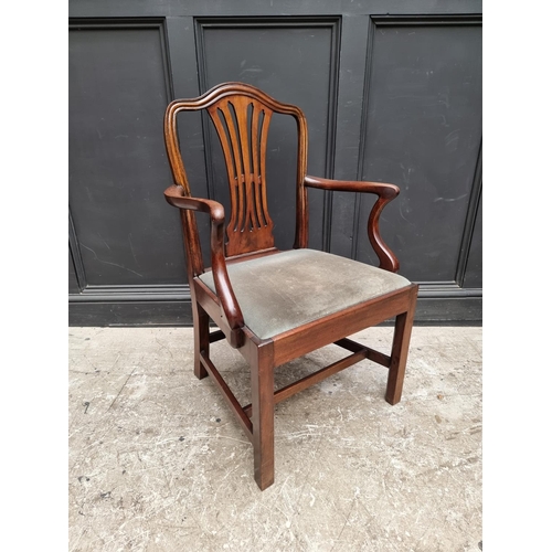 1081 - A George III mahogany elbow chair.